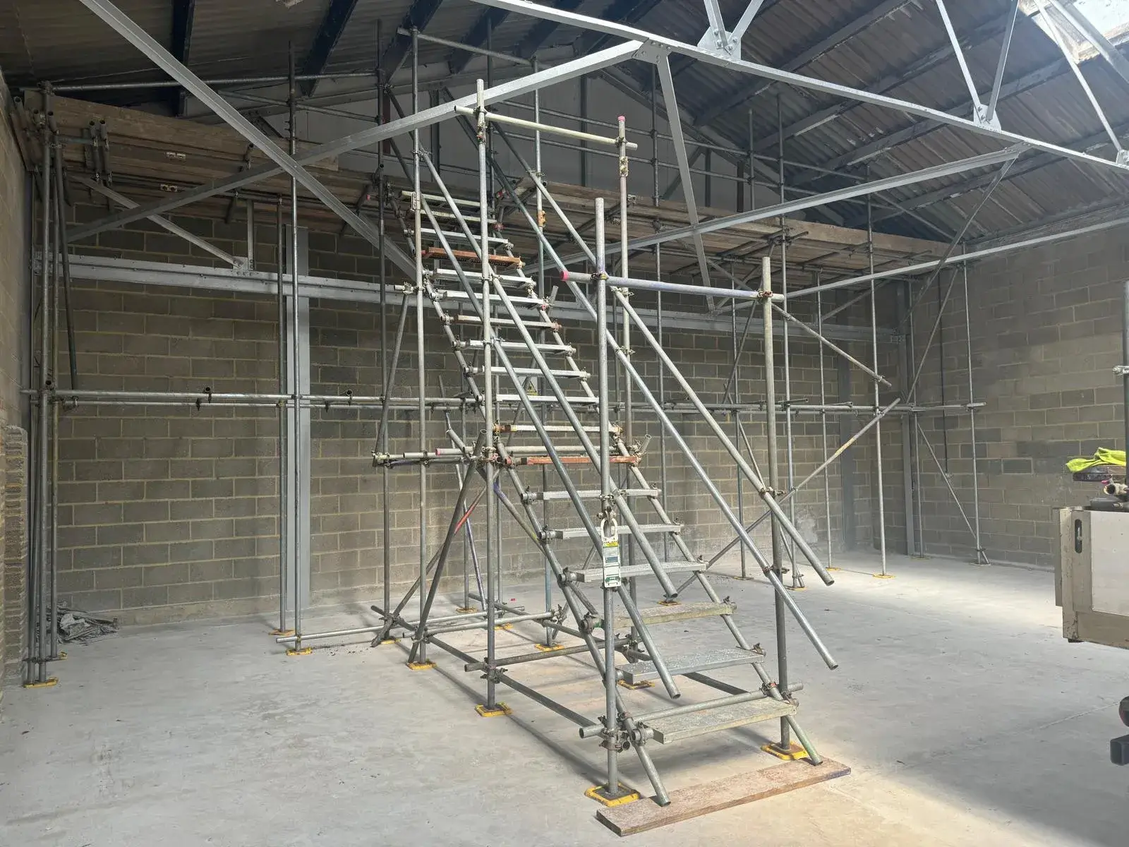 A building with scaffolding in the middle of it.